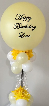 Happy birthday LOVE print bobo balloon with 4 white balloons yellow flowers on stick and cluster of balloons and yellow flowers at bottom basket