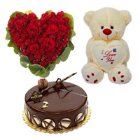 8 to 10 inches Teddy bear with Half Kg chocolate cake and 20 Red roses Heart