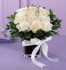 36 White roses in glass vase