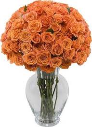 36 orange roses in a glass vase