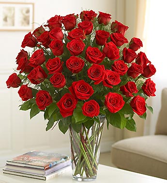 36 red roses in a glass vase