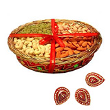Dry fruit in a basket with 3 diyas