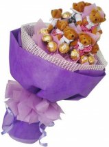 16 ferrero 7 Teddy bears(6 inches each)in same bouquet with purple wrapping