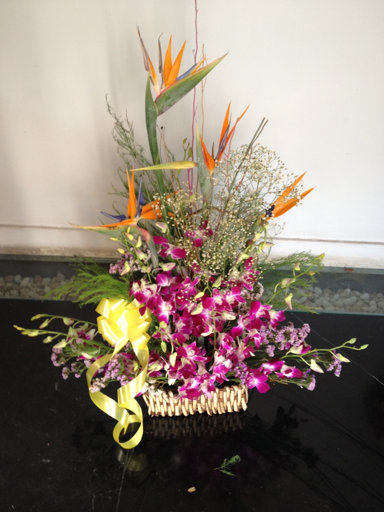 Bird of paradise and orchids basket