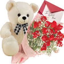 Dozen red roses with teddy and card