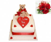Teddy on cake with icing i love you and 5 roses free