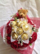 10 Red Roses with 5 ferrero and 1 teddy bear (6 inches each)in same bouquet